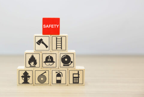 Wooded blocks Stacking with safety icons.
